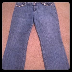 Blue jeans with gold decoration on pockets